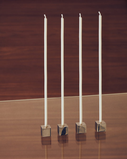 Acadia set of 4 stainless steel candle holders with a shiny silver finish