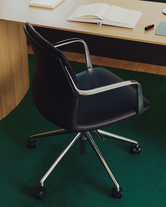 Nerlan desk chair in black faux leather with aluminium frame