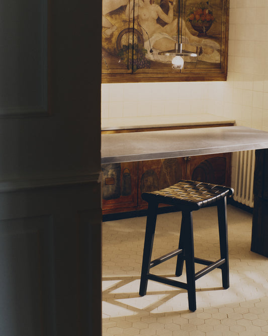 Calixta stool in leather and solid mahogany wood with black finish, 67 cm height