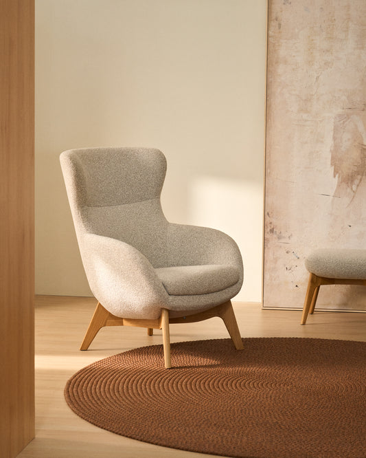 Adiran armchair in beige thick chenille with solid oak wood legs with a walnut finish