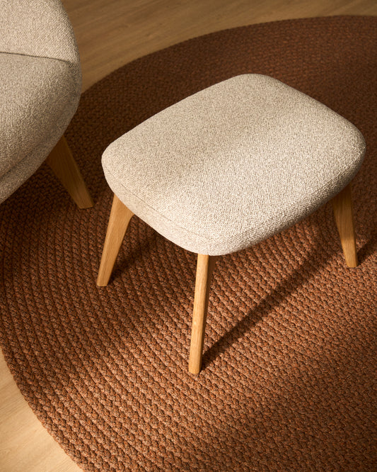 Adiran footrest in beige thick chenille with solid oak wood legs with a natural finish