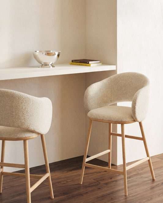 Maina stool in thick beige chenille with solid ash wood legs and a natural-tone finish, FSC Mix Credit 65 cm