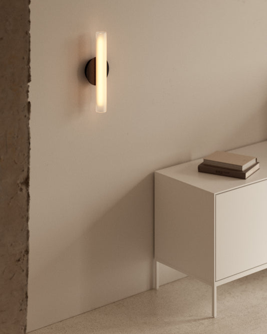 Vauxall wall sconce made of metal and frosted glass.