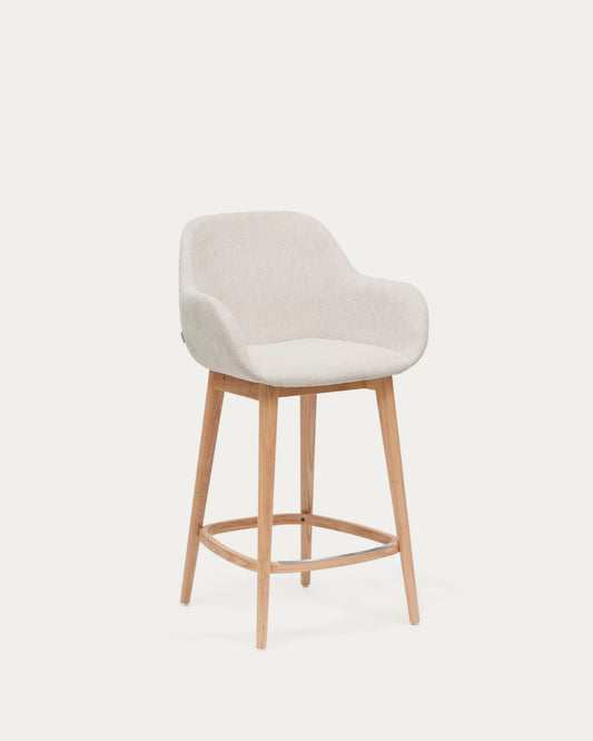 Konna stool in beige and solid ash wood legs in a light finish, 65 cm