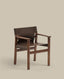 Jan chair made of dark brown recycled leather fibres and FSC 100% solid ash wood with walnut-coloured finish
