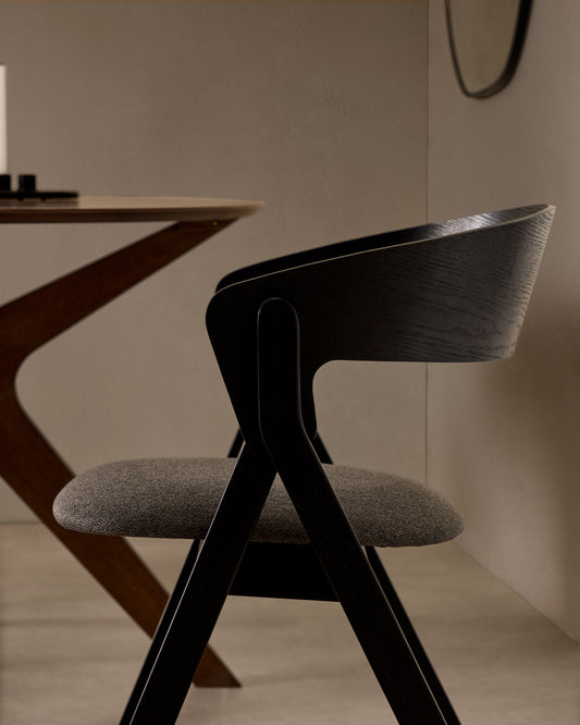 Godia chair in ash veneer with a black finish and grey chenille