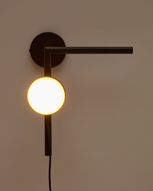 Orey black metal wall-mounted light fixture with multi-position spotlight
