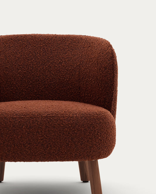 Ulit armchair in terracotta bouclé with solid ash wood legs in a walnut finish